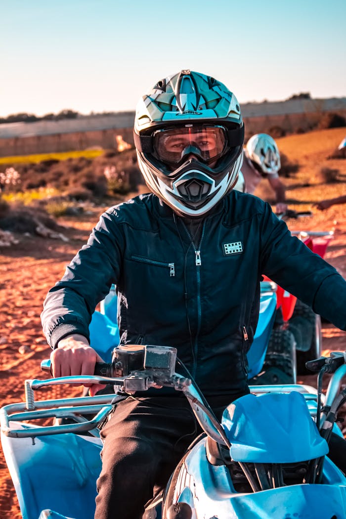 A man riding an ATV through the Moroccan desert landscape, showcasing adventure and excitement.